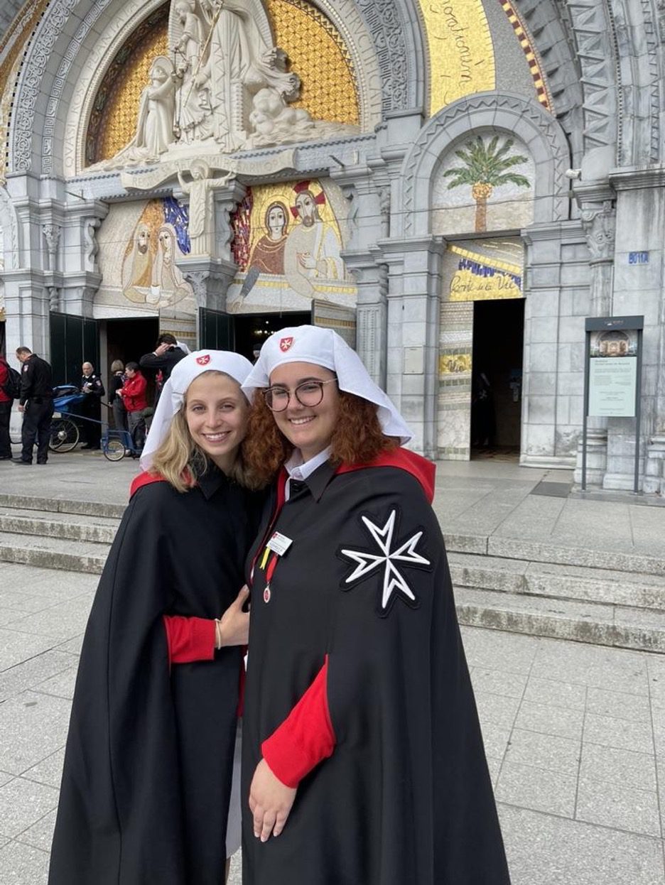 Allison Malloy '23 and Emma Pehote '23 in Lourdes in the uniform of the Order of Malta.