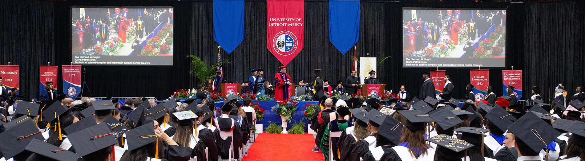 Graduates walk across the stage during 太阳城娱乐城's Commencement ceremonies.