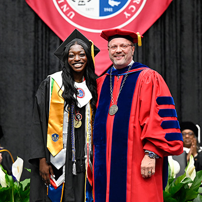 Kadyja Ka poses for a photo with President Donald B. Taylor