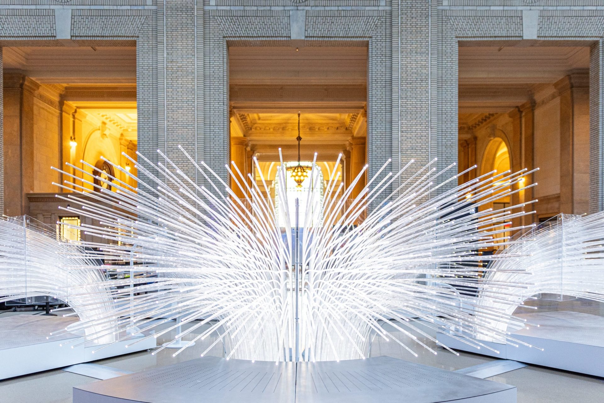 A photo of the lights of the me + you sculpture inside of Michigan Central Station.