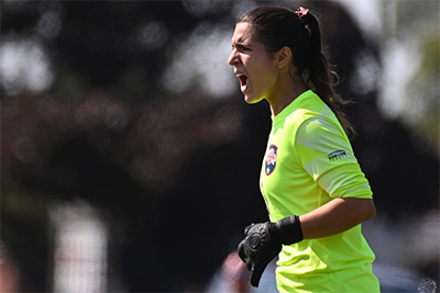 Marisa Silver reacts in celebration during a soccer game.