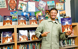 Cayden Brown holds his book 