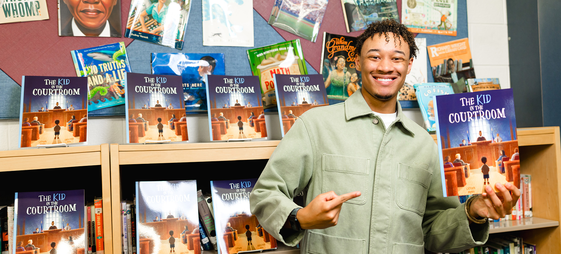 Cayden Brown holds his book 