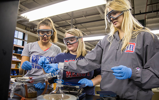 Students conduct an experiment.