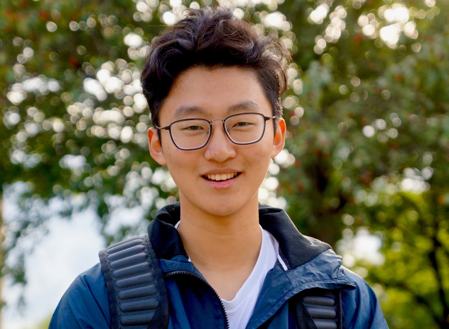 An international student smiles.