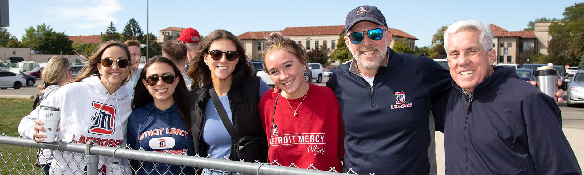 a group of alumni at homecoming softball game