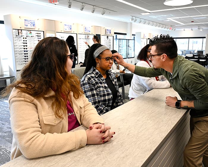 patient getting glasses adjustment