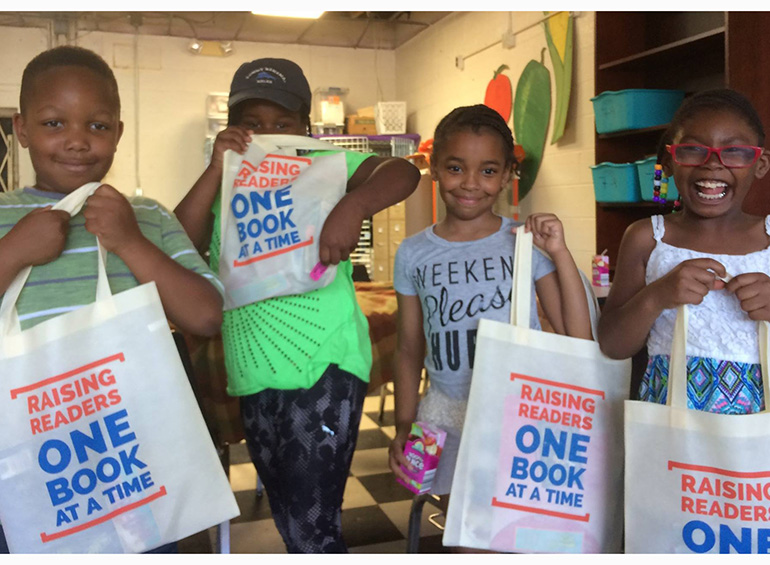 childen holding rx for reading bags