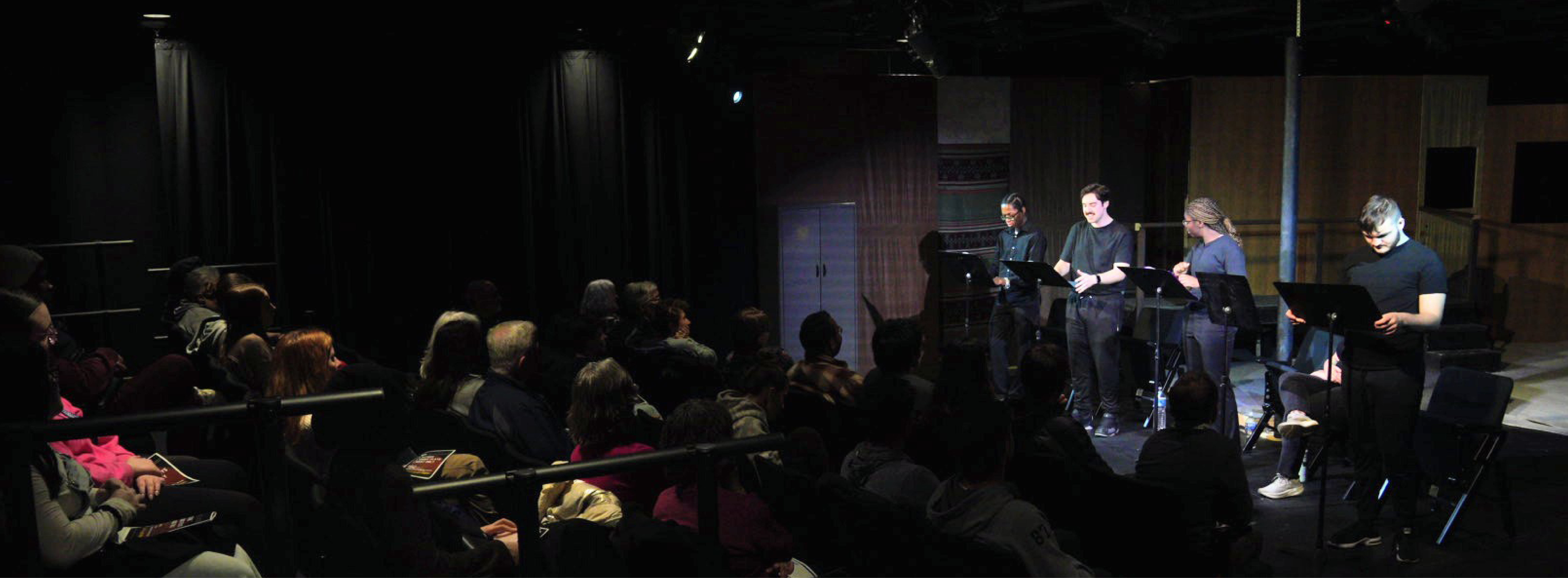 Actors reading in front of an audience